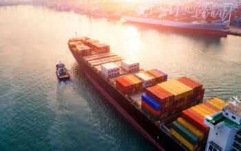 Ship for container with working crane bridge in shipyard for Logistic Import Export background